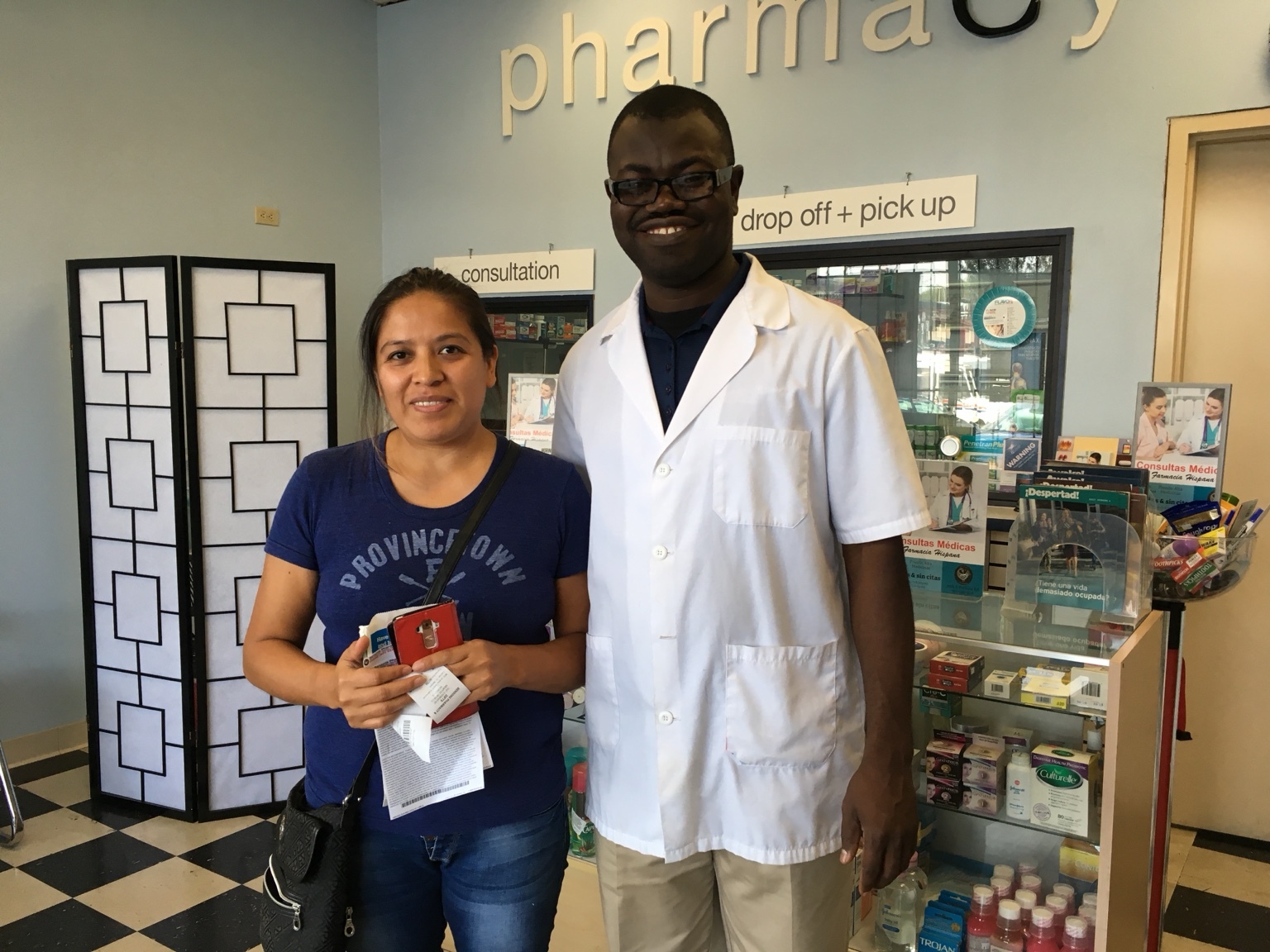 Two people pose at the pharmacy